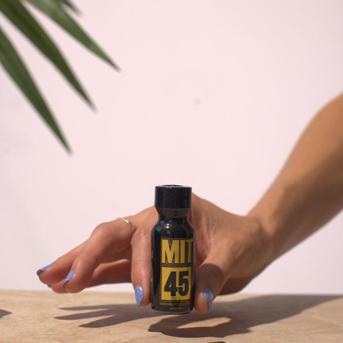 Someone holding a MIT45 Gold Liquid unit.